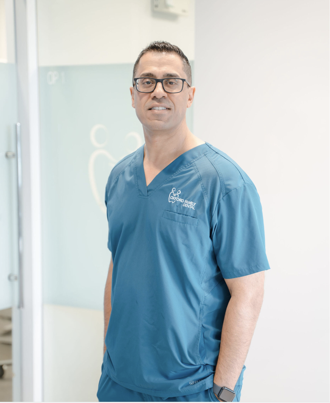 Dr. G. Chahal in Oxford Family Dental scrubs